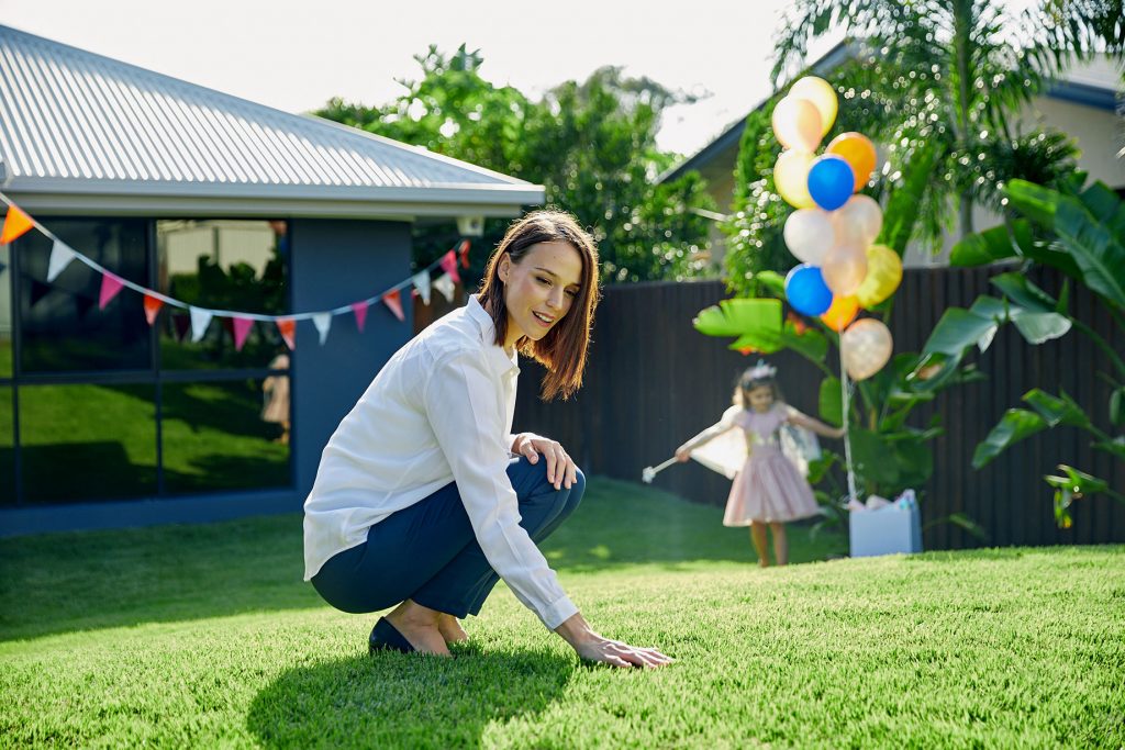 Woman & Child Touching Soft Zoysia Lawn