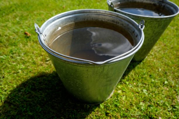 grey water in bucket