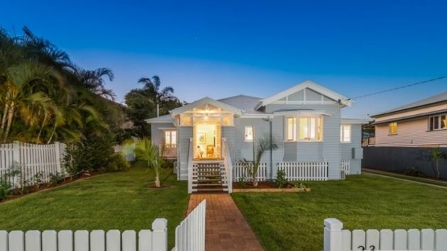 Brisbane Queenslander Home with Green Front Lawn